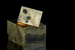 Macro mineral stone Pyrite on a black background photo