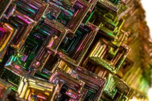 Macro of the mineral bismuth stone on a white background photo