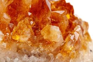 Macro mineral stone Citrine in rock in crystals on a white background photo