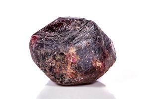 Macro of a mineral garnet stone on a white background photo