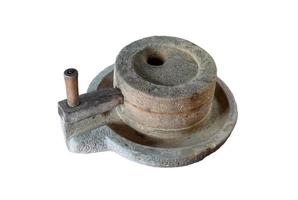 Thai ancient grinding stone isolated on white background with clipping path. photo