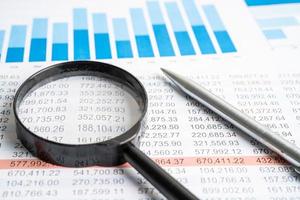 Pen on chart or graph spreadsheet paper. Financial, account, statistics and business data concept. photo