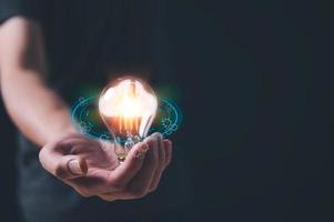 cloud computing internet network technology concept, man holding Light bulb with cloud computing Global Internet connection.  application technology photo