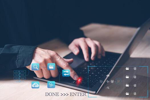 the concept of finished job done, businessman working with computer laptop pressing enter button for finishing work. save work, done and enter. finalise, submitting. photo