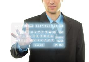 Businessman and virtual keyboard photo