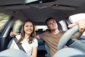 Young couple in a car photo