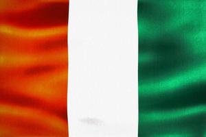 Ivory Coast flag - realistic waving fabric flag photo