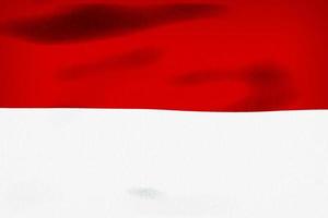 Ilustración 3d de una bandera de indonesia - bandera de tela ondeante realista foto