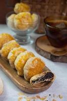 selective focus on crispy dry bakpia snacks usually served with hot tea suitable for eating when breaking the fast in the month of Ramadan. soft focus photo