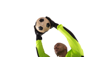 Goalkeeper catches the soccer ball during a football match png