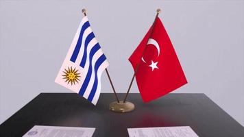 Uruguay and Turkey flags at politics meeting. Business deal video