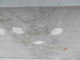 Old cracked balcony railing slab in need of repair photo