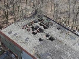 Old collapsed roof in an industrial building photo