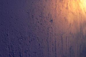 Cement wall with roughness, cracks and bumps. Abstract grunge background. photo