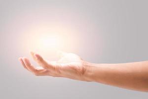 Male hand to hold something on a gray background. photo