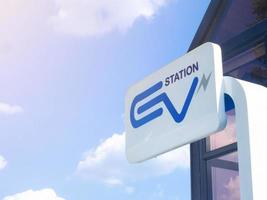 Signpost station Ev charger technology automobile energy power clean energy symbol blue green ecology vehicle alternative hybrid plug in generator car engine blue sky background copy space.3d render photo