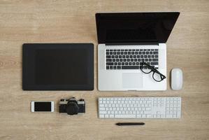 Top view of business workplace with laptop and gadgets photo