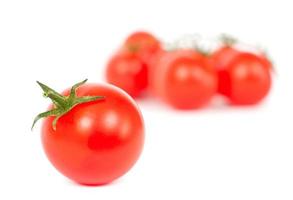 Tomatoes on a white photo