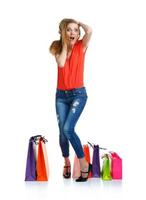 Emotional lovely woman with shopping bags over white photo