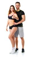 Athletic man and woman after fitness exercise with thumbs up on the white photo