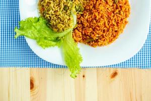 Delicious dish made of two kinds of rice on a white plate photo