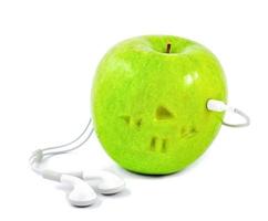 green apple in which headphones photo