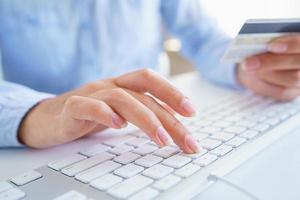 Male hands typing on the keyboard photo