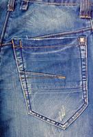 Fragment of jeans with pocket. photo