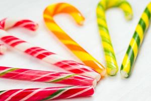 Christmas candy cane on a wooden background photo