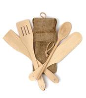 Wooden kitchen utensils isolated on white background photo