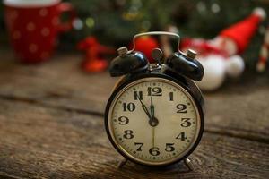 Vintage alarm clock on christmas background photo