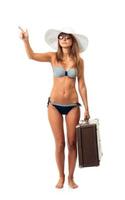 Full length portrait of a beautiful young woman posing in a bikini on white photo