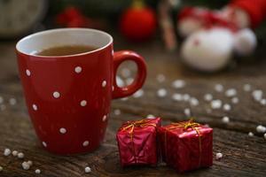 Close up of tea cup with christmas decoration on wooden table photo