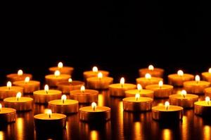 Many burning candles with shallow depth of field photo