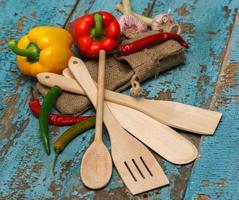 Wooden spoons with vegetables photo