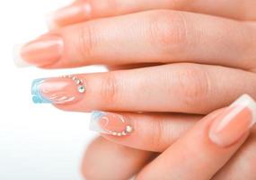 Beautiful female hands with french manicure photo