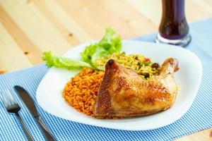 Tasty dish of chicken thigh with rice photo