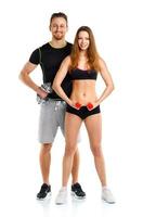 deporte Pareja - hombre y mujer con pesas en el blanco foto