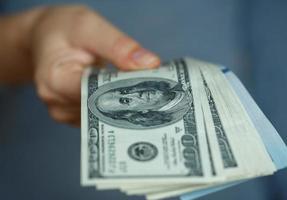 Woman hand with dollar bills photo