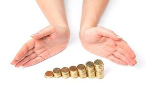 Hands and coins on white photo