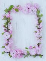 Flowers frame on white wooden photo