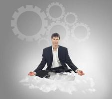 Businessman on a cloud photo