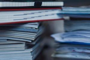 Large pile of magazine, notebook and books closeup photo