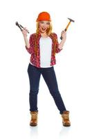 Young woman in helmet with the work tools on a white photo