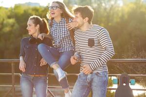 Smiling friends having fun outdoors photo