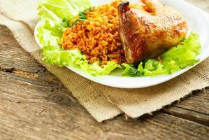 Tasty dish of chicken thigh with rice photo