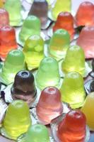 close up of colorful jelly in a plastic container photo