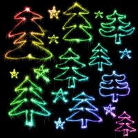 Colorful christmas tree made by sparkler on a black photo