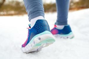 Runner getting ready for jogging outdoors in winter photo