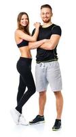 Athletic man and woman after fitness exercise on the white photo